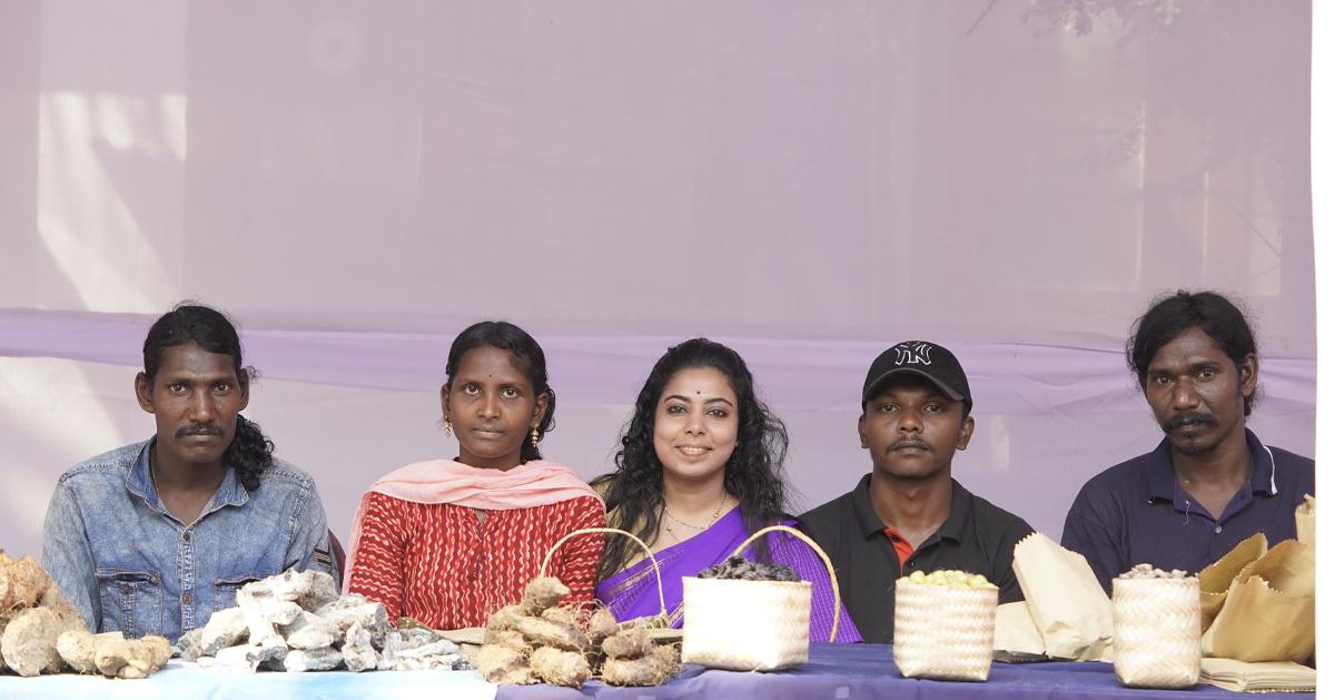 Mani (first from right) with a group of Cholanaikkas carrying forest produce at a fair held at Kirthads in Kozhikode in January 2025 