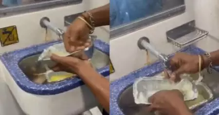 ട്രെയിനിനുള്ളില്‍ യാത്രക്കാര്‍ ഉപയോഗിച്ച ഫോയില്‍ പാത്രങ്ങള്‍ കഴുകിയെടുക്കുന്ന ജീവനക്കാര്‍; വീഡിയോ, പ്രതിഷേധം