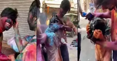 ഹോളി ആഘോഷത്തിനിടെ വിദേശ വനിതക്കെതിരെ യുവാക്കളുടെ അക്രമം; വീഡിയോ