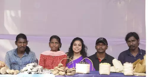 Mani (first from right) with a group of Cholanaikkas carrying forest produce at a fair held at Kirthads in Kozhikode in January 2025 